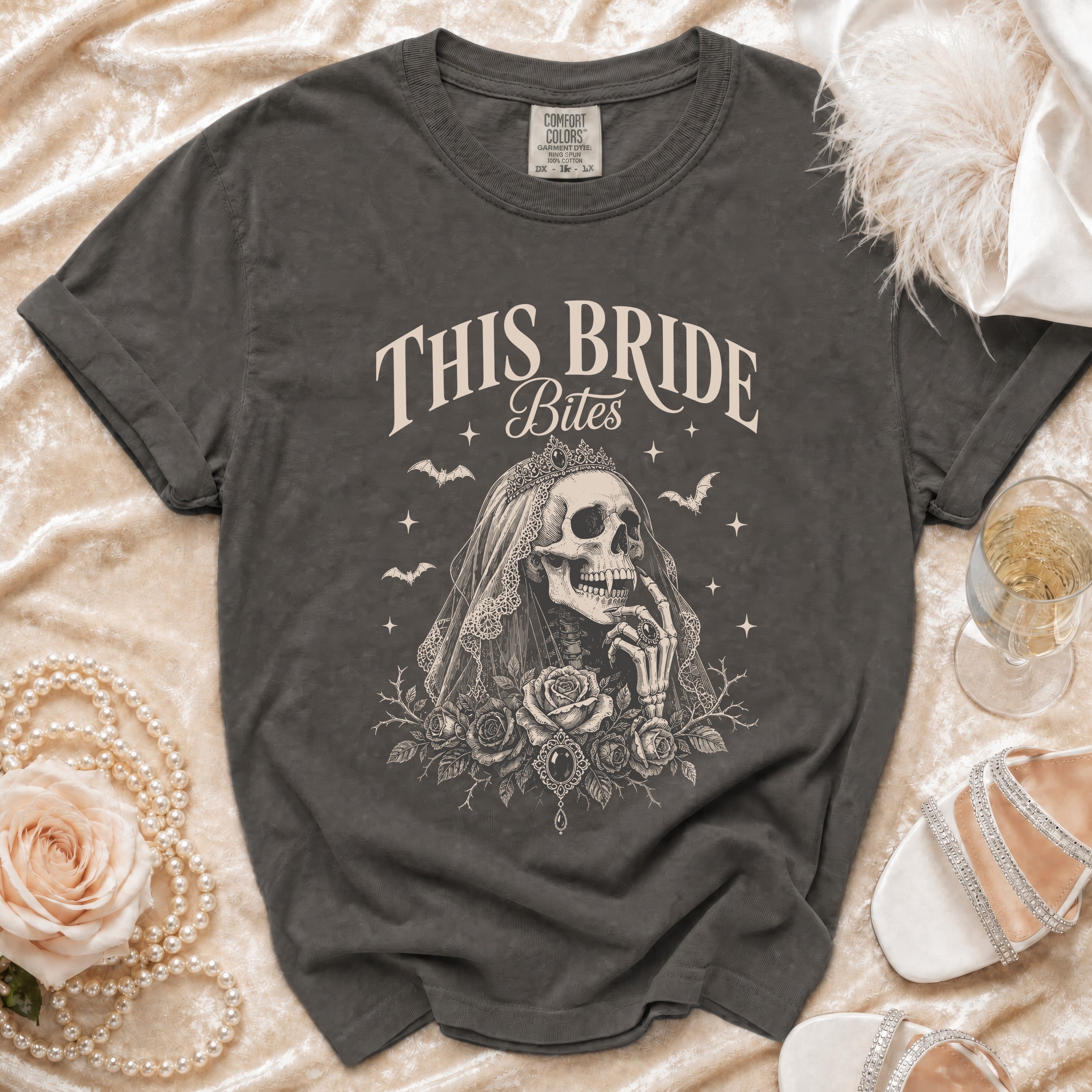 Dark gray t-shirt with "This Bride Bites" text and skeleton bride graphic.