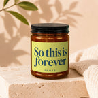 Amber glass candle with yellow label that reads "So this is forever. vowed."