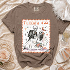 Brown t-shirt with "Til Death €22" design featuring skeletons at a wedding.