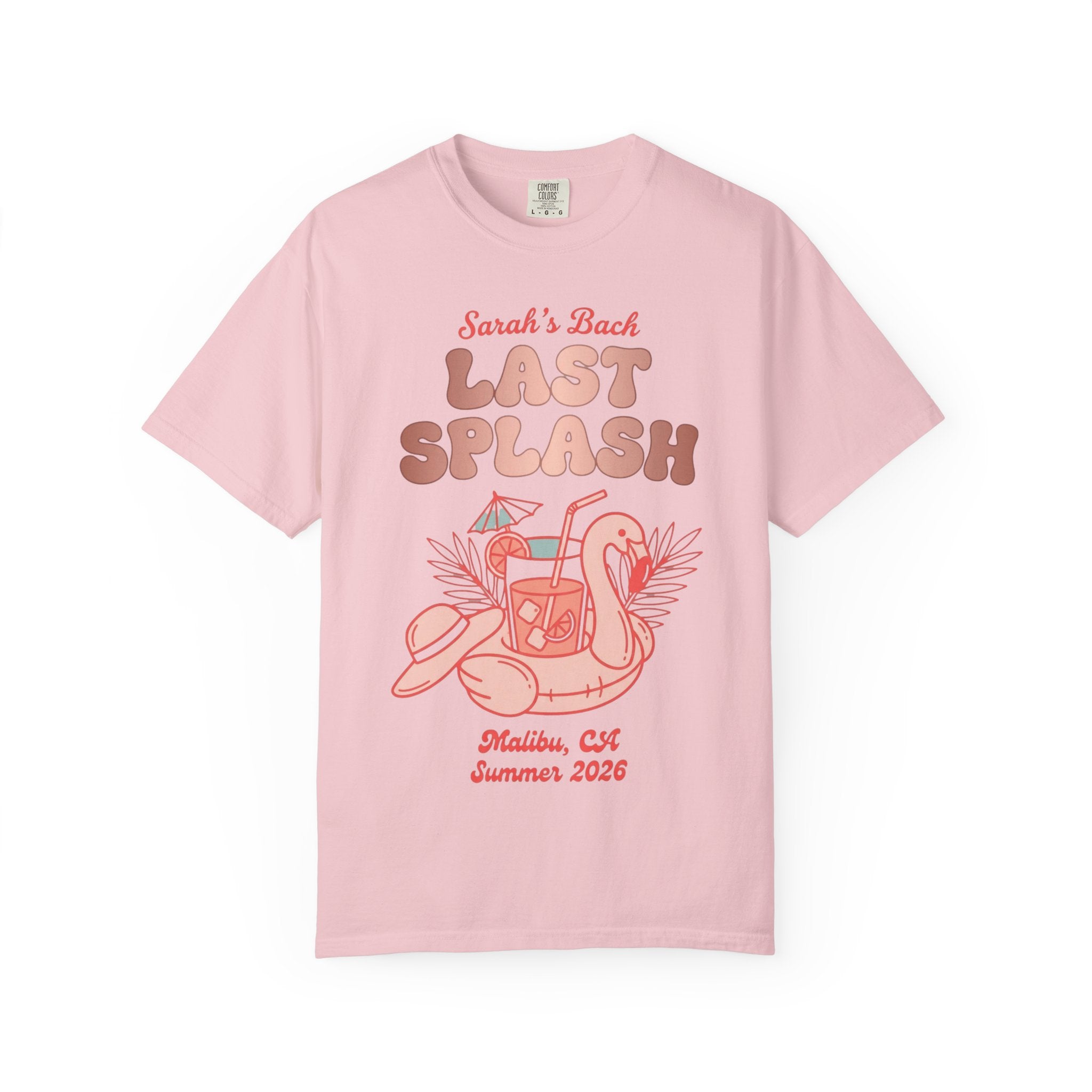 Pink t-shirt with "Sarah's Last Splash" graphic featuring flamingo float and tropical drink.