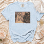 Skeleton bride in a wedding dress holding a drink, with a haunted mansion and bats on the shirt.