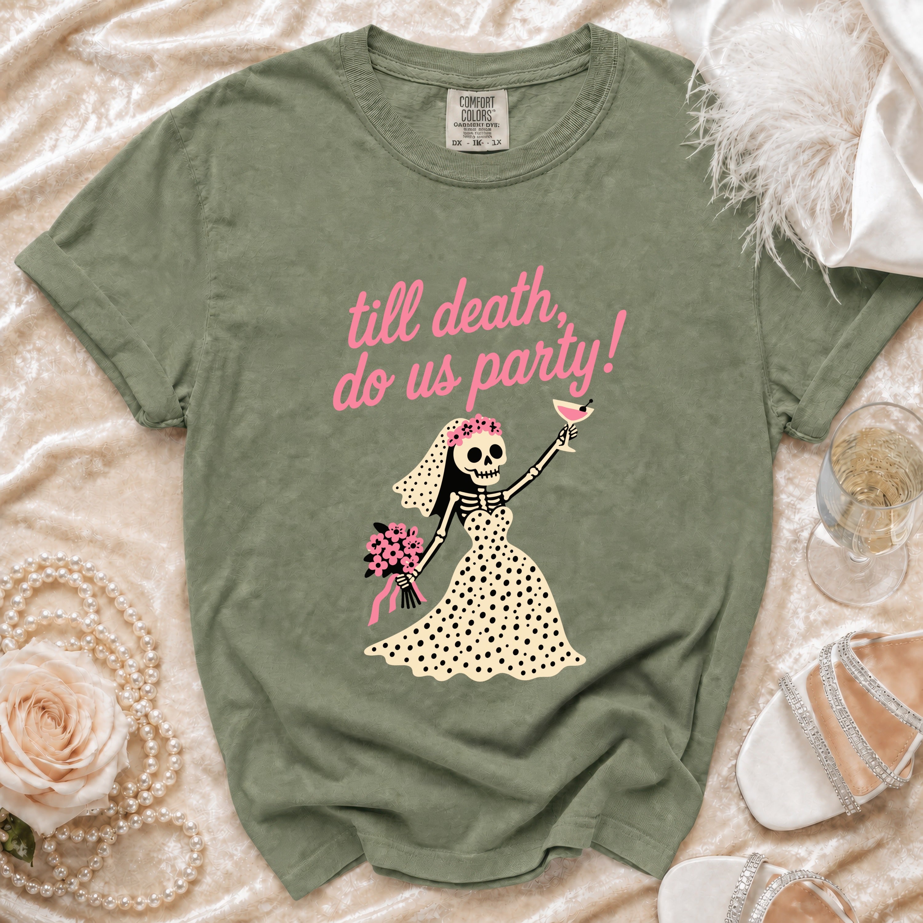Green t-shirt with "till death, do us party!" text and skeleton bride graphic.