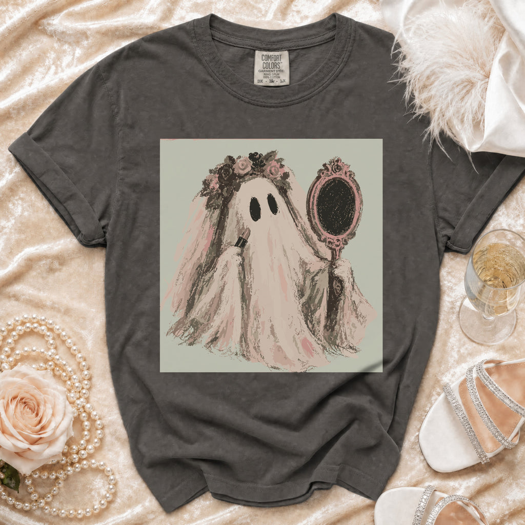 Ghost bride applying lipstick in mirror on charcoal grey t-shirt.
