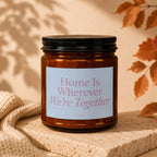 Brown glass candle with "Home Is Wherever We're Together" on the label.