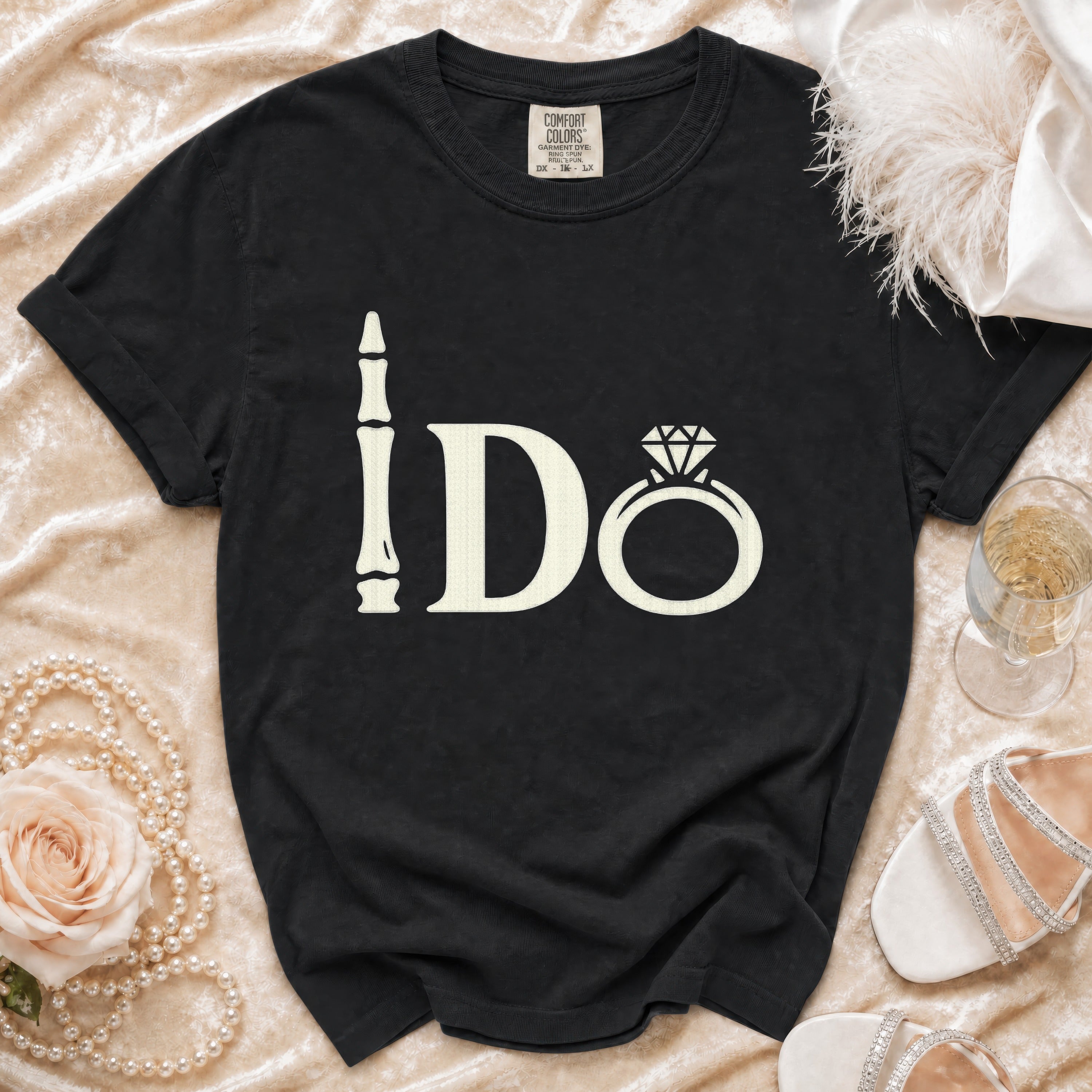 Black t-shirt with "I Do" text, featuring a bone-like "I" and a diamond ring.