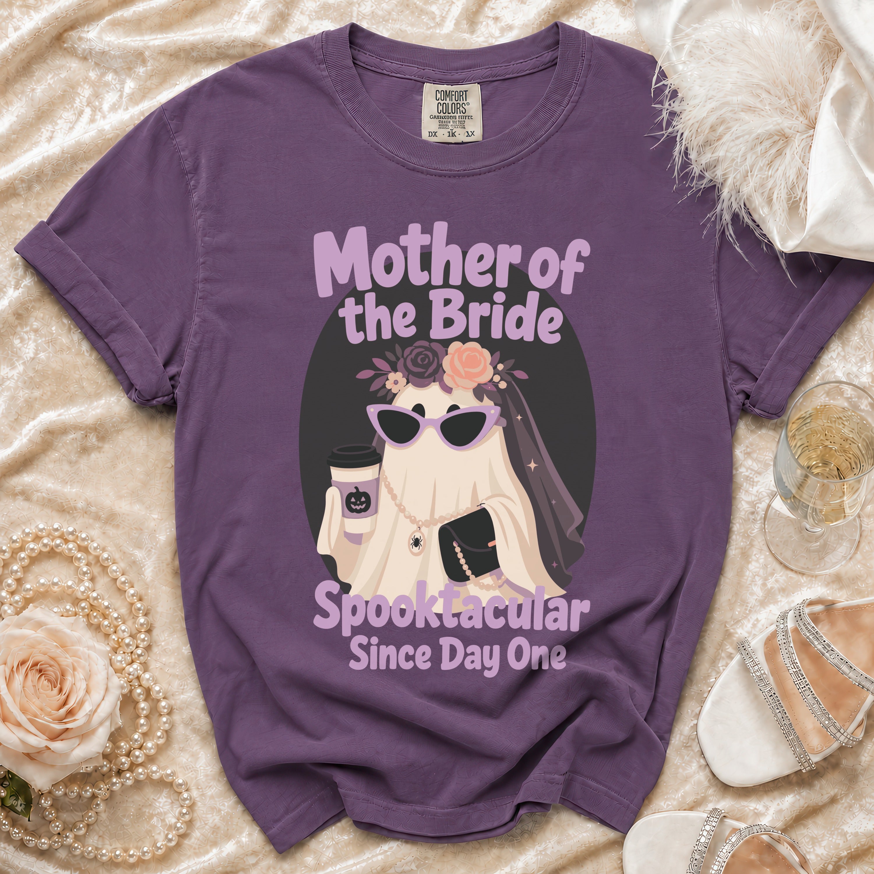 Purple t-shirt with "Mother of the Bride Spooktacular Since Day One" graphic.