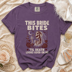 Purple t-shirt with "This Bride Bites 'Til Death Looks Good On Me" text and skeleton bride graphic.