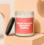 Candle with text "Light me when you're toasting the happy couple" and "Vowed".
