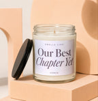 Glass candle with label reading "Smells Like Our Best Chapter Yet VOWED".