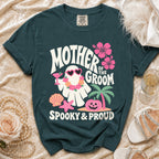 Teal t-shirt with "Mother of the Groom Spooky & Proud" text, featuring a ghost.