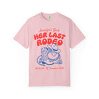 Pink t-shirt with "Jennifer's Bach Her Last Rodeo" and cowboy boots.