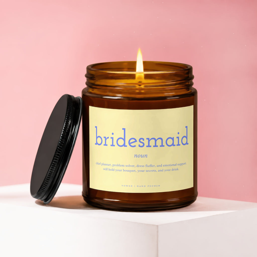 Amber candle with "Bridesmaid noun" and descriptive text on label.