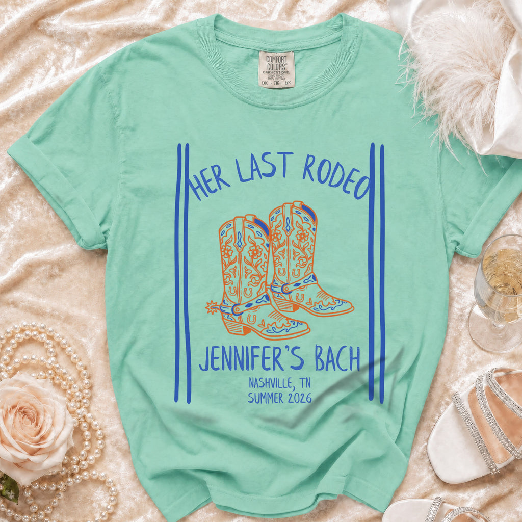 Mint t-shirt with "Her Last Rodeo Jennifer's Bach Nashville, TN Summer 2026" and cowboy boots.