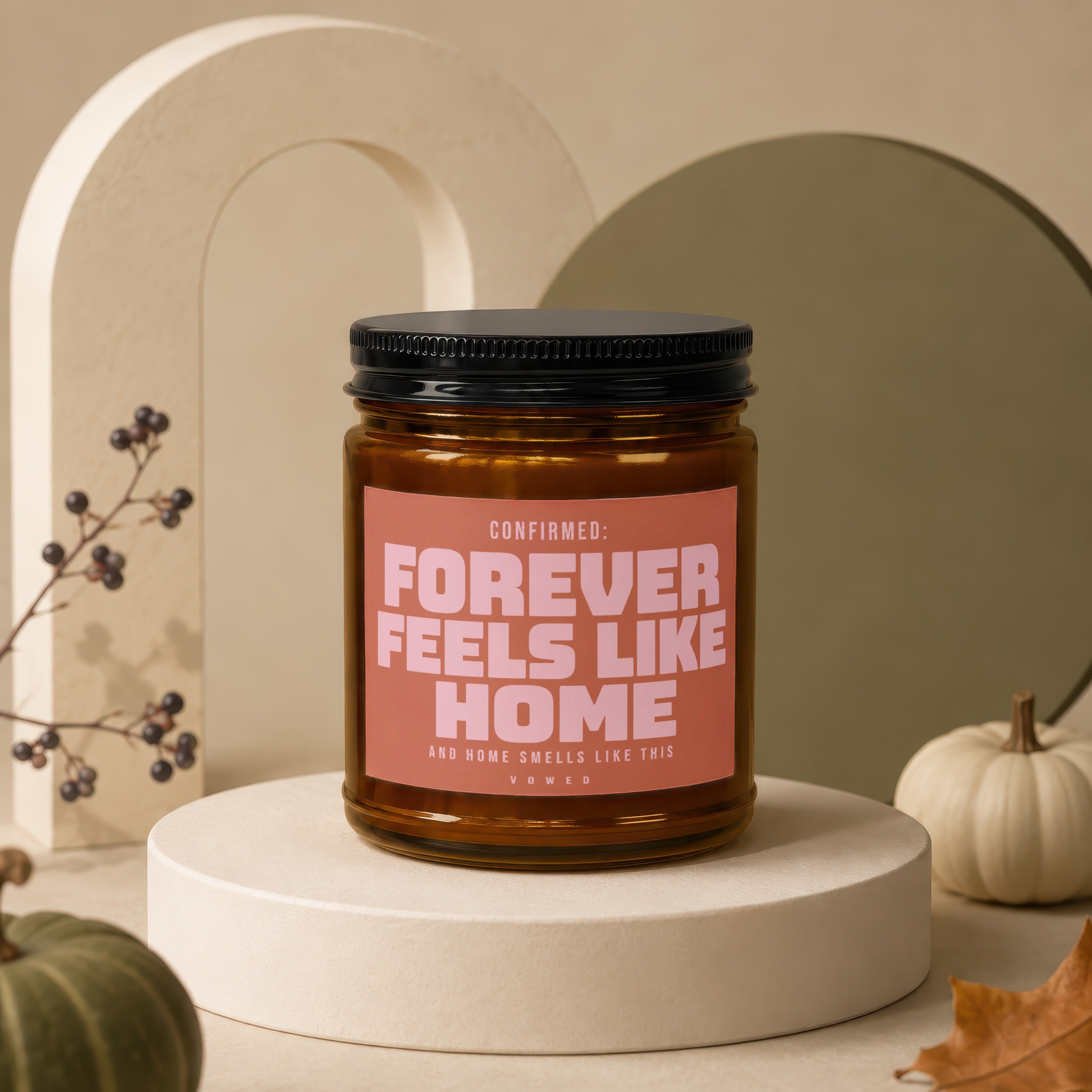 Candle with text "Forever Feels Like Home" surrounded by autumnal decor.