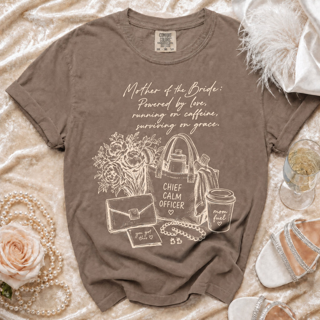 Brown t-shirt with "Mother of the Bride: Powered by love, running on caffeine, surviving on grace" text and graphics.