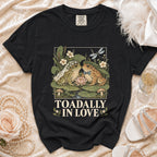 T-shirt with two frogs, one in a veil, text "TOADALLY IN LOVE".