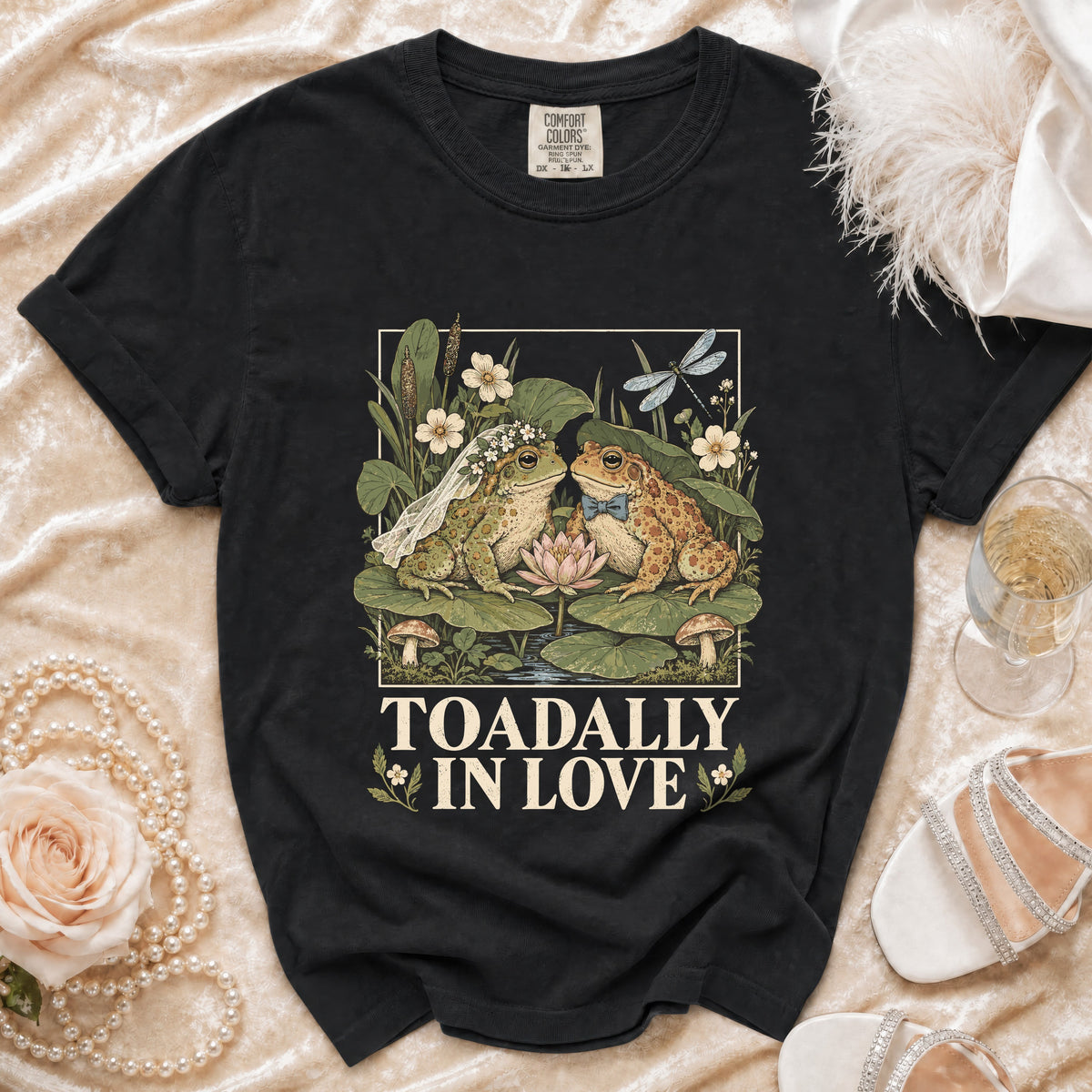 T-shirt with two frogs, one in a veil, text "TOADALLY IN LOVE".