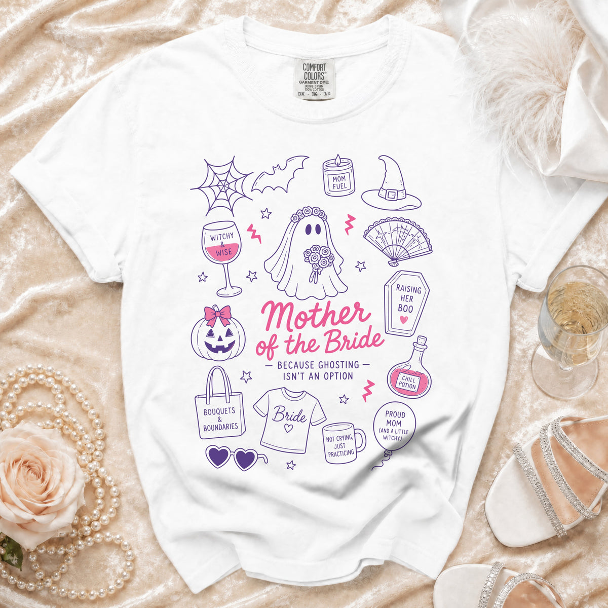 White t-shirt with "Mother of the Bride" text and Halloween-themed bridal illustrations.