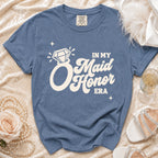 Blue t-shirt with "In My Maid Honor Era" graphic, diamond ring, and stars.