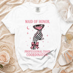 White t-shirt with "MAID OF HONOR, PROFESSIONAL CHAOS COORDINATOR." text and graphics.