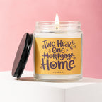 Glass candle with flame and "Two Hearts, One Mortgage Home" text on yellow label.
