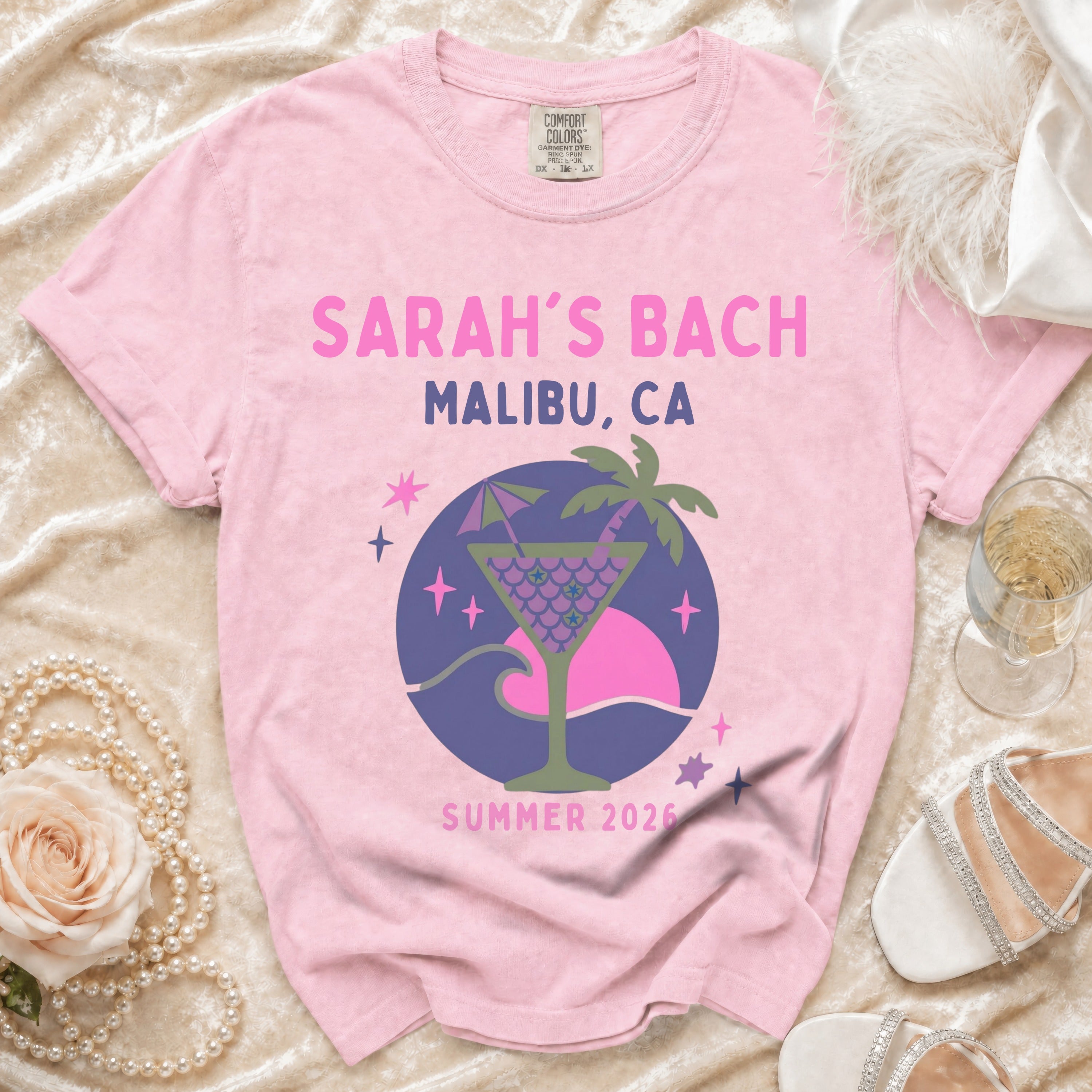Pink t-shirt with "Sarah's Bach Malibu, CA Summer 2026" and cocktail graphic.