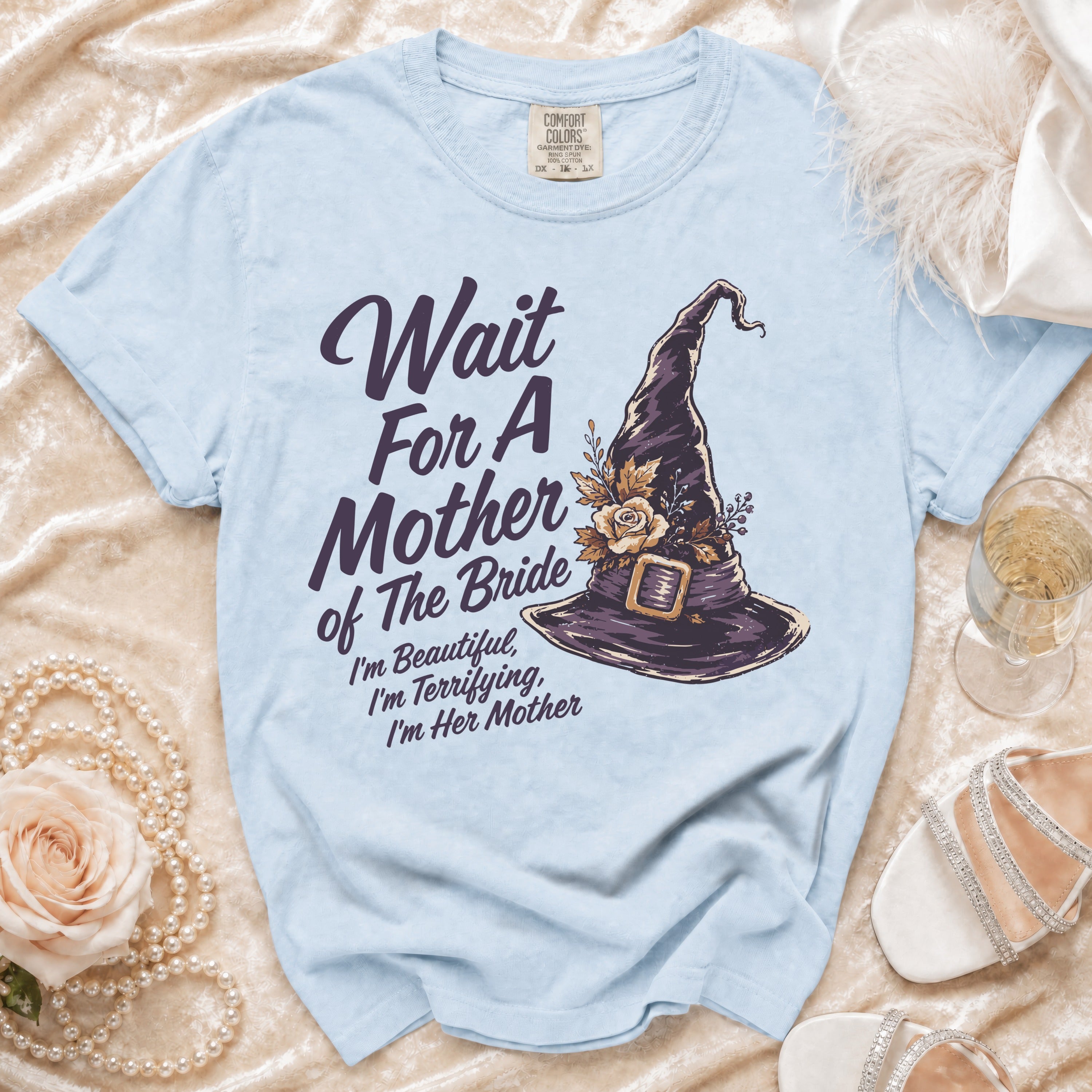 Light blue t-shirt with "Wait For A Mother of The Bride" and witch hat graphic.