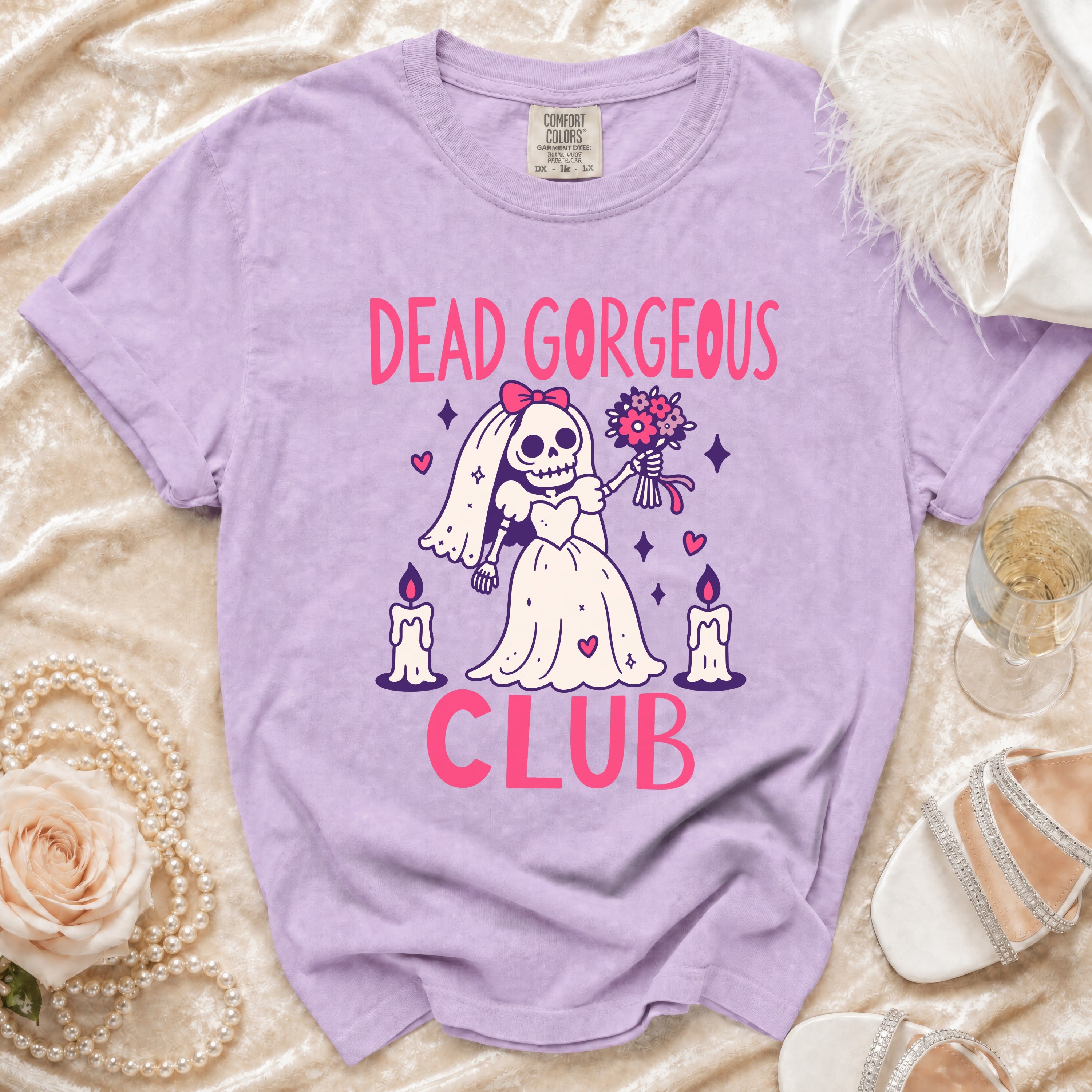 Lavender t-shirt with "DEAD GORGEOUS CLUB" graphic featuring a skeleton bride.
