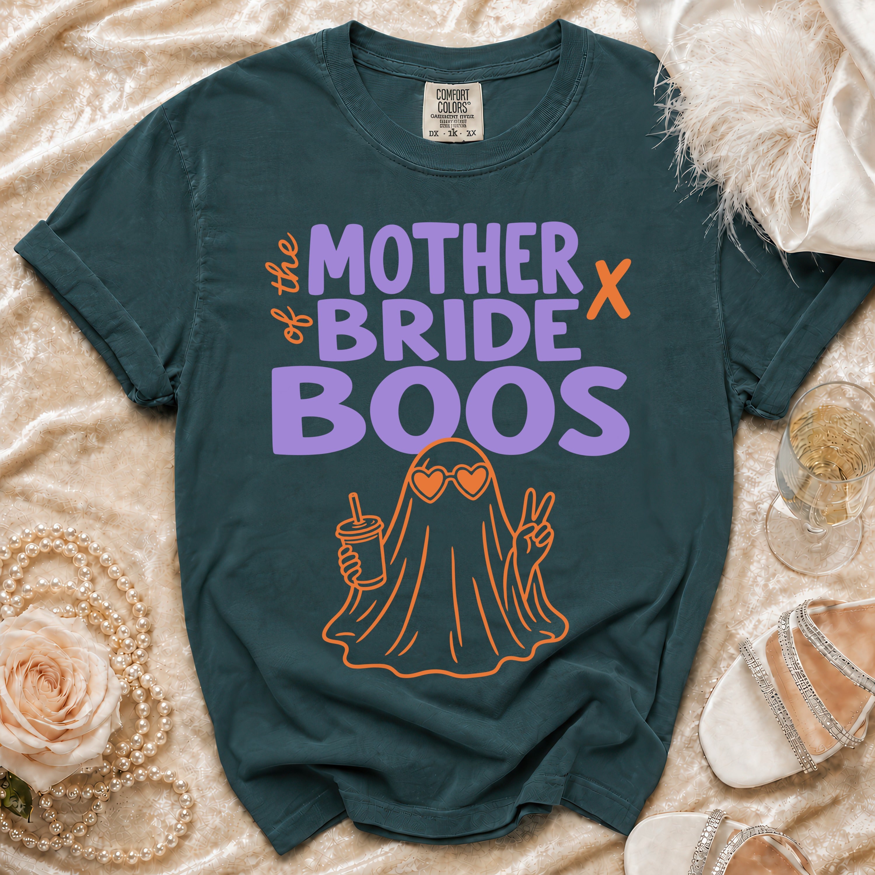 Teal t-shirt with "Mother of the Bride Boos" text and ghost graphic.
