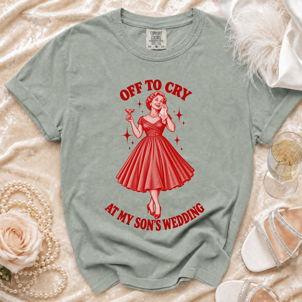 T-shirt with "Off to Cry at My Son's Wedding" graphic and a woman holding a drink.
