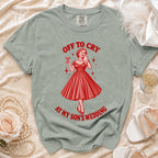 T-shirt with "Off to Cry at My Son's Wedding" graphic and a woman holding a drink.