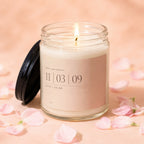 Anniversary candle with "11|03|09 RUTH + CALEB OUR DAY" text.