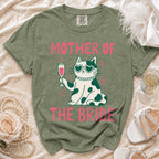 Green t-shirt features a cat wearing heart sunglasses holding champagne: "Mother of the Bride".
