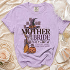 Purple t-shirt with "Mother of the Bride Boo Crew (I'm Just Here For The Candy)" Halloween graphic.