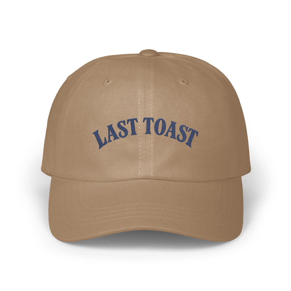 Tan baseball cap with "LAST TOAST" embroidered in blue on the front.