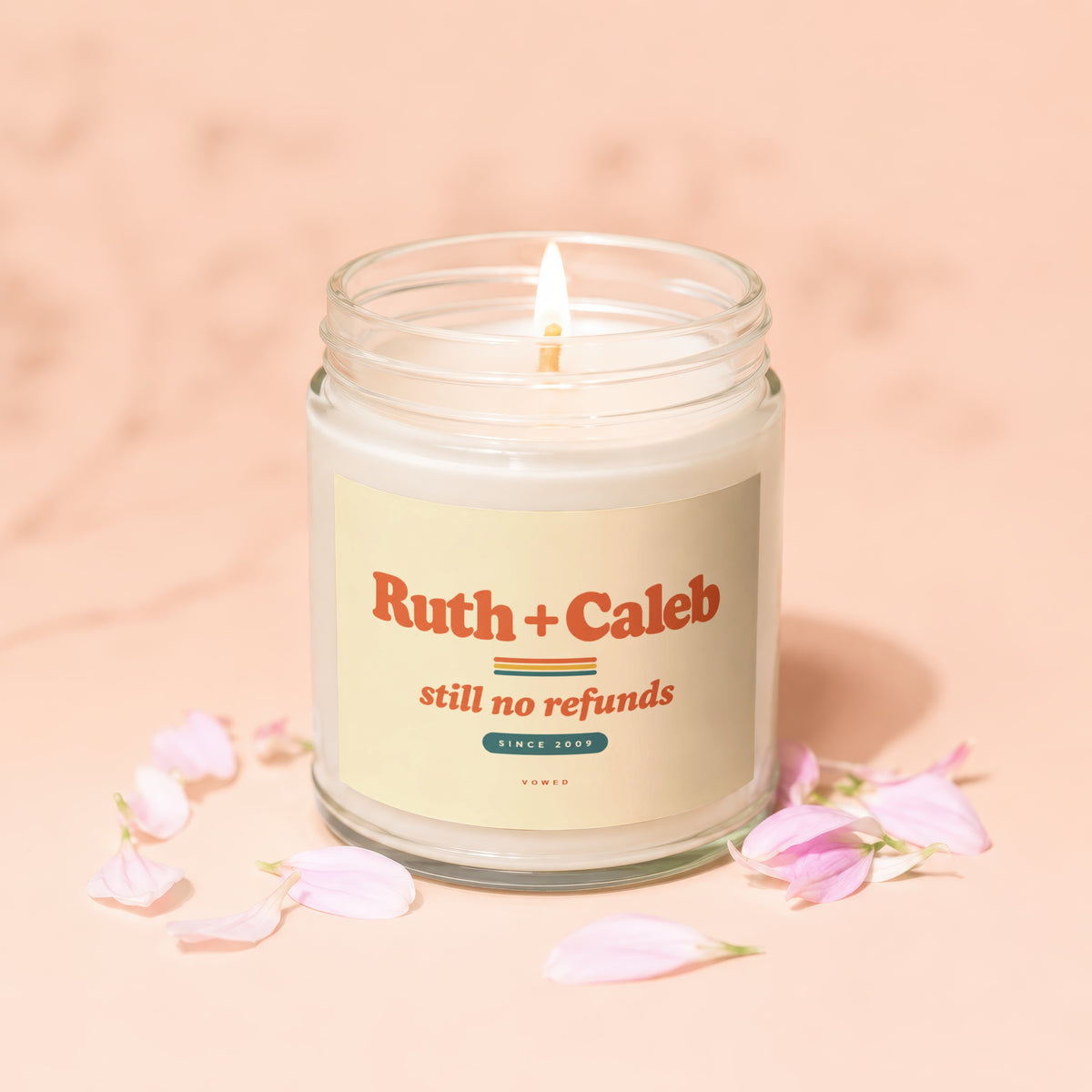 Candle with label "Ruth + Caleb still no refunds since 2009".