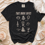 Black t-shirt with "This Bride Bites" and gothic wedding illustrations.