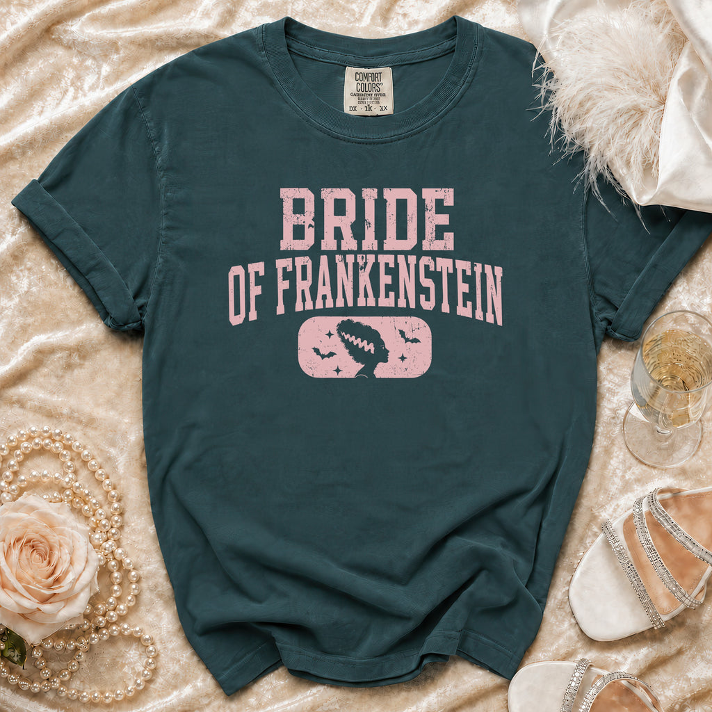 Bride of Frankenstein graphic t-shirt with vintage details on a teal shirt.