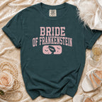 Bride of Frankenstein graphic t-shirt with vintage details on a teal shirt.