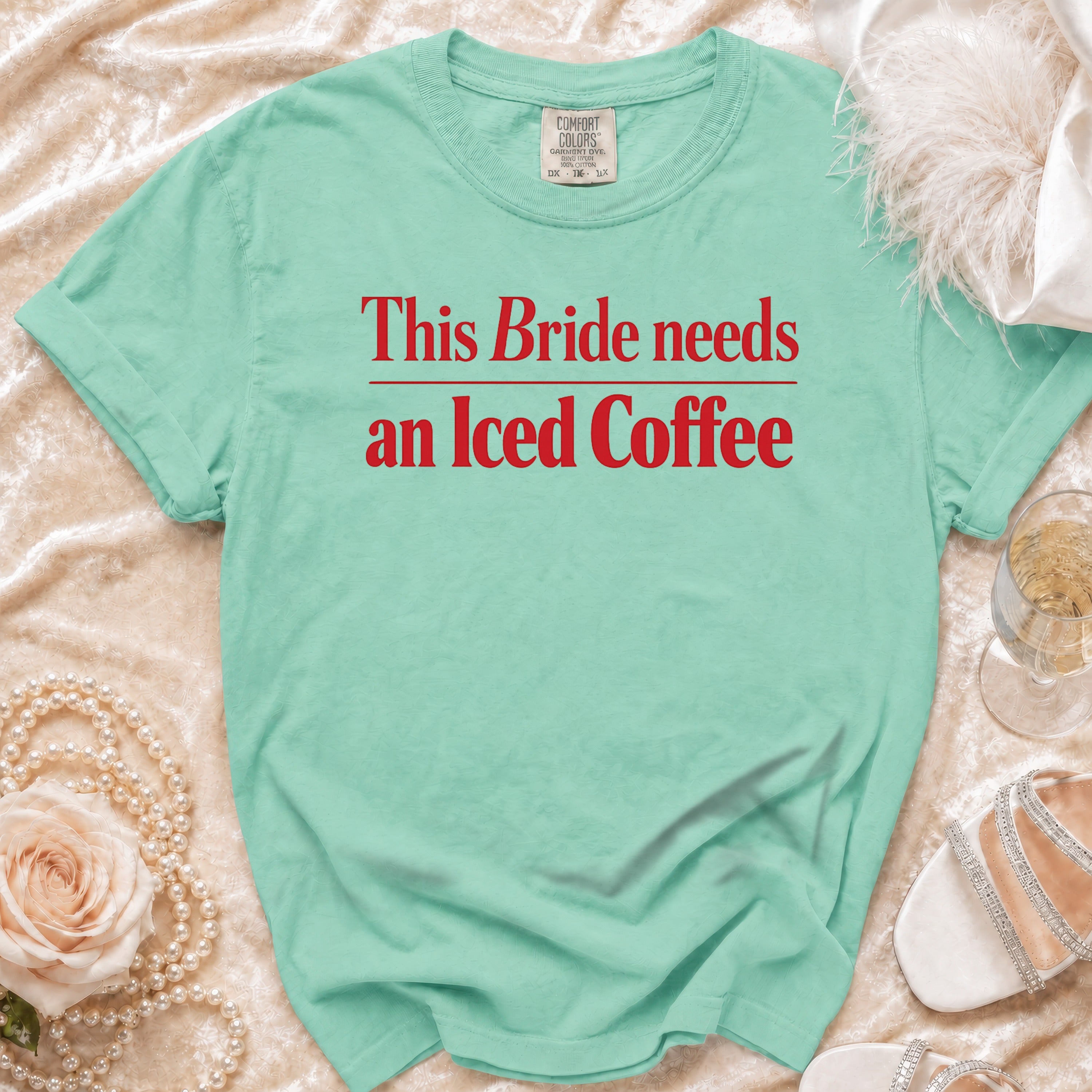 Mint t-shirt with red text "This Bride needs an Iced Coffee".