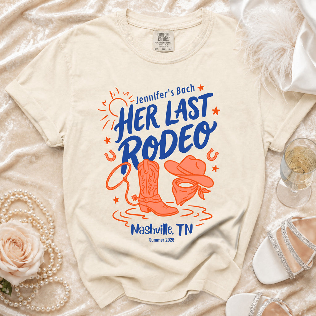 Cream t-shirt with "Jennifer's Bach HER LAST RODEO Nashville, TN Summer 2026" text.