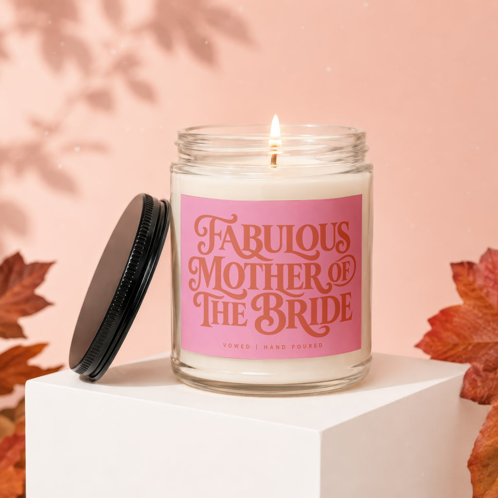 Candle with "Fabulous Mother of the Bride" text on pink label.