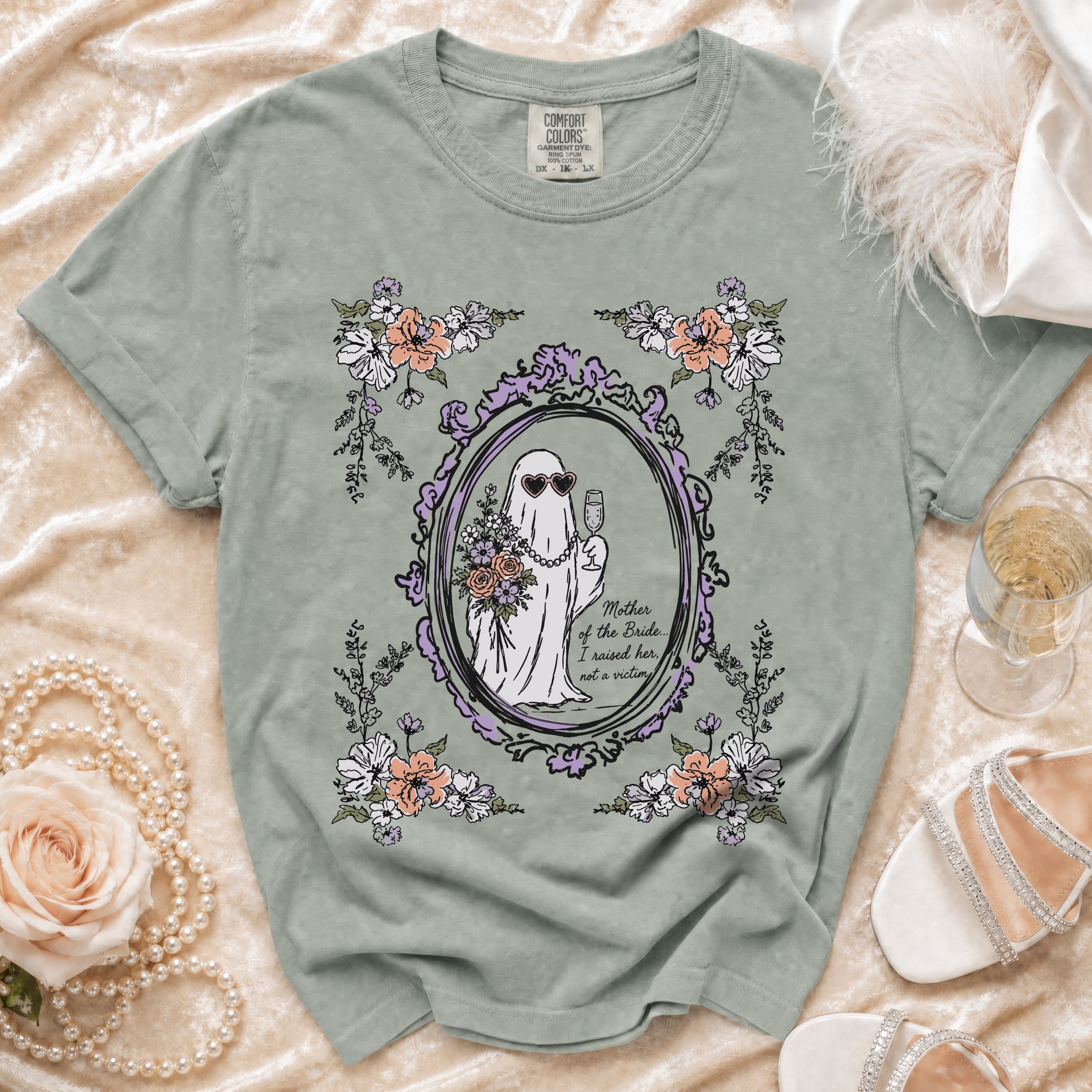 Green t-shirt with a ghost bride graphic and text: "Mother of the Bride... I raised her, not a victim."