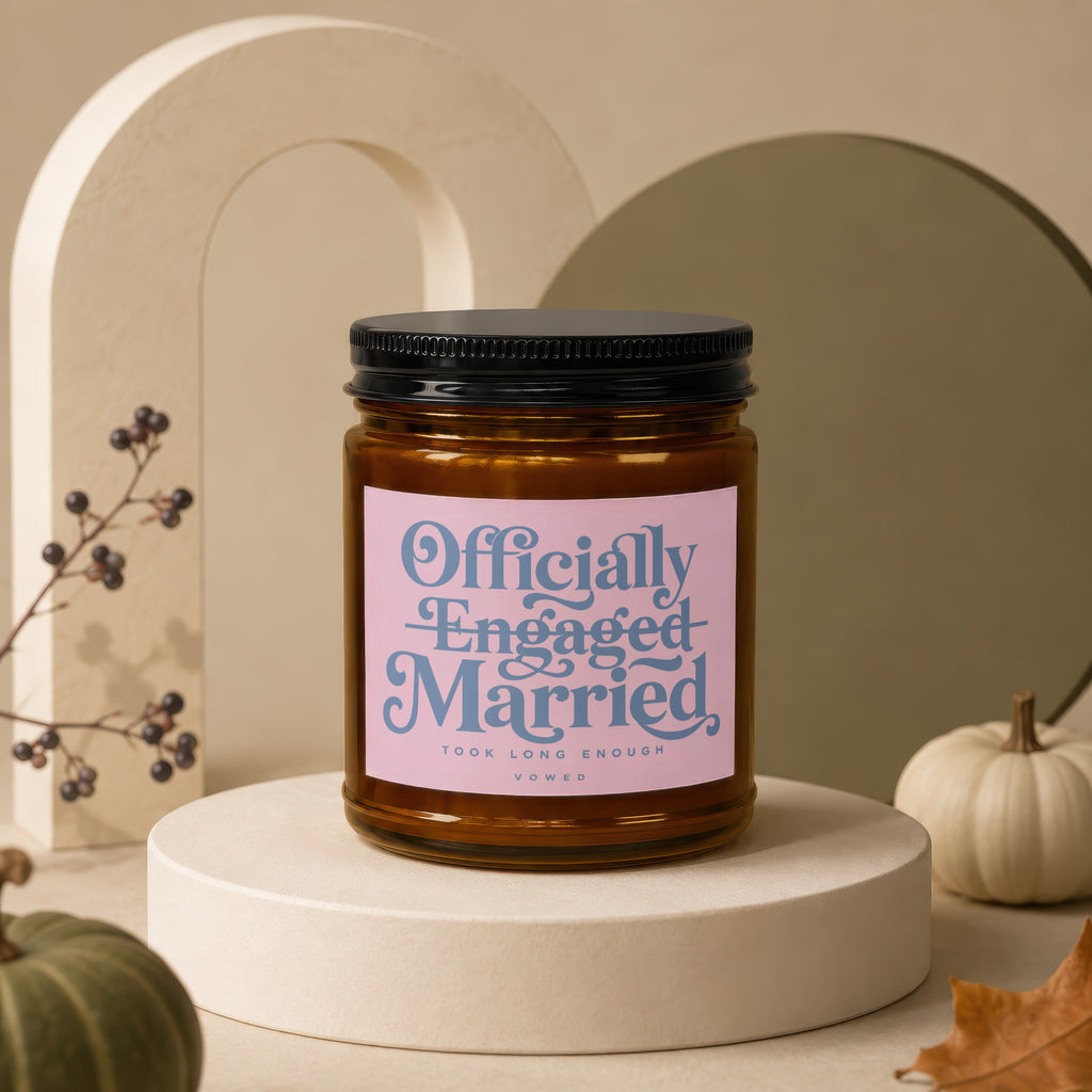 Candle with text "Officially Engaged Married Took Long Enough Vowed".