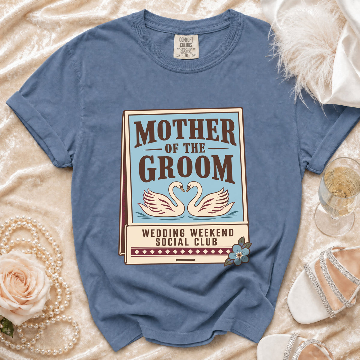 Blue t-shirt with "Mother of the Groom Wedding Weekend Social Club" graphic.