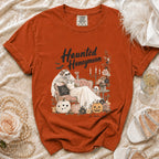 Orange Comfort Colors t-shirt with "Haunted Honeymoon" graphic of skeleton bride and pumpkins.