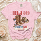 Pink t-shirt with "Her Last Rodeo Jennifer's Bach Nashville" text and cowboy boots.