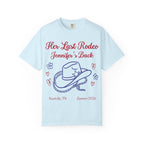 Light blue t-shirt with "Her Last Rodeo Jennifer's Back" text and cowboy hat.