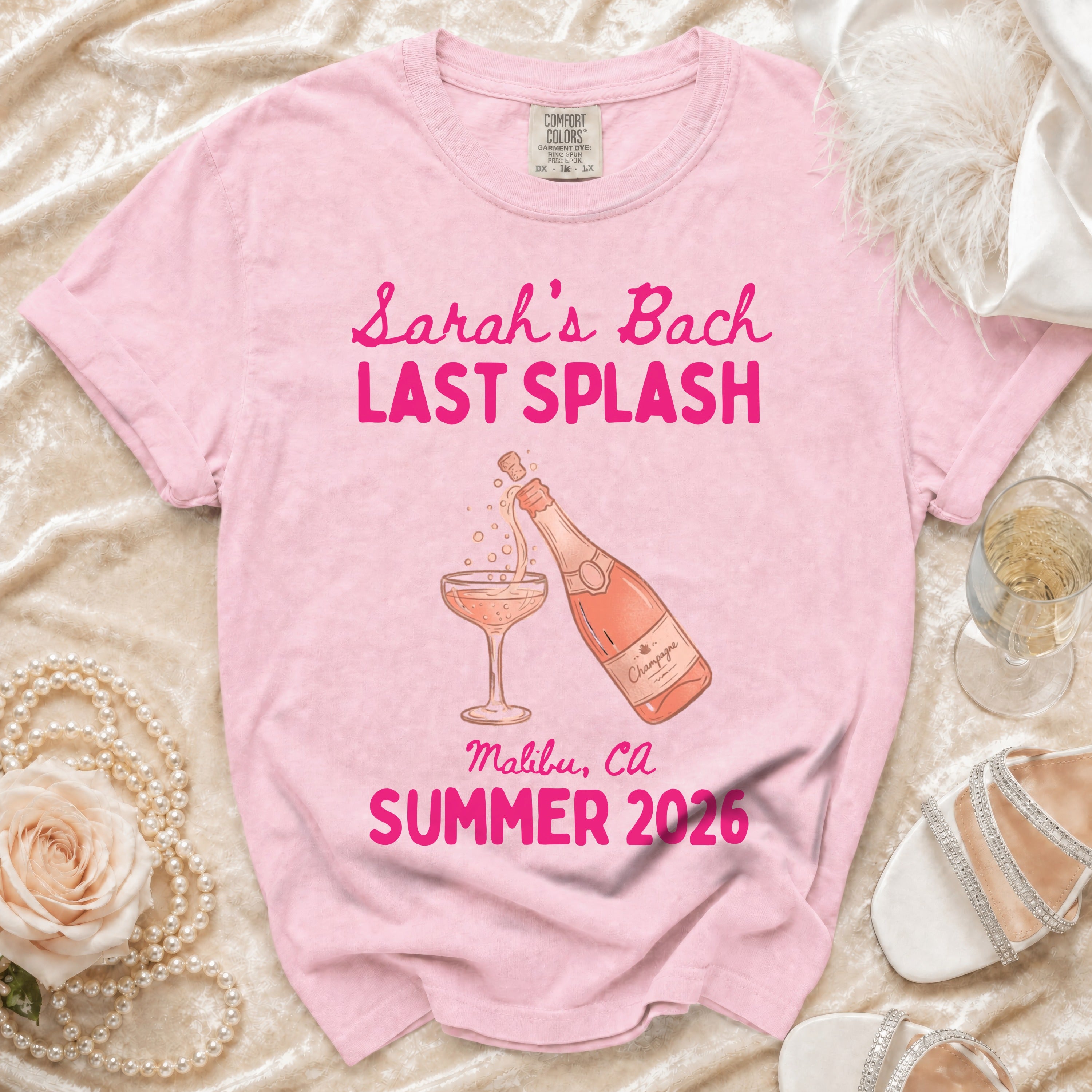 Pink t-shirt with "Sarah's Bach Last Splash" and champagne graphic.