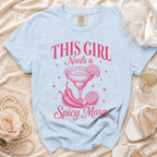 Light blue t-shirt with pink graphic "THIS GIRL Needs a Spicy Marg" and margarita.